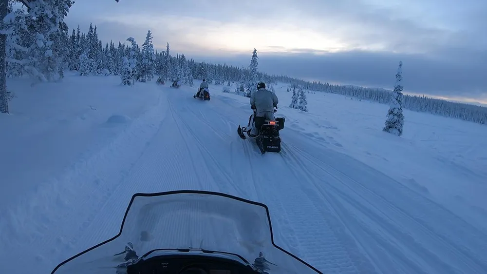 G2 Strategic Partnership tactical training operators on snowmobiles in winter environment